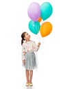 happy girl in birthday party hat with balloons Royalty Free Stock Photo