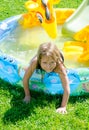 Happy girl in blowup pool