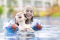 Happy Girl and Boy Enjoying in Swimming Pool Royalty Free Stock Photo