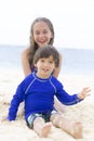 Happy Girl and Boy Playing at the beach Royalty Free Stock Photo