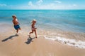 Happy girl and boy run and play with water at beach Royalty Free Stock Photo