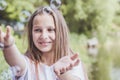 Happy girl catches soap bubbles