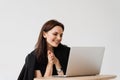 Happy girl chatting with family and friends via video call on white background. Successful business woman with laptop Royalty Free Stock Photo