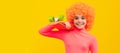 Happy girl child with orange hair in pink poloneck smile holding penny board, pennyboard. Funny teenager child on party Royalty Free Stock Photo