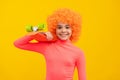 Happy girl child with orange hair in pink poloneck smile holding penny board, pennyboard Royalty Free Stock Photo