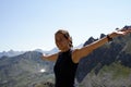 Happy girl climber on a mountain top