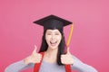 Happy  girl college student in Graduation cap  with success gesture Royalty Free Stock Photo