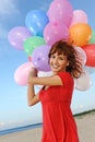 Happy girl with colorful balloons Royalty Free Stock Photo