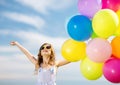 Happy girl with colorful balloons Royalty Free Stock Photo