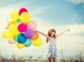 Happy girl with colorful balloons Royalty Free Stock Photo