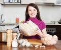 Happy girl cooking chinese noodles with seafood Royalty Free Stock Photo