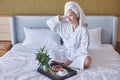 Happy Girl with a Cup of Coffee. Home Style Relaxation Woman Wearing Bathrobe and Towel after Shower. Spa Good Morning Royalty Free Stock Photo