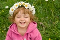 Happy girl with daisy wreath