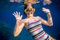 Happy girl dive in Red sea Royalty Free Stock Photo