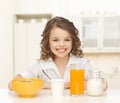 Happy girl eating healthy breakfast Royalty Free Stock Photo