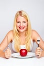 Happy Girl eating an red apple Royalty Free Stock Photo
