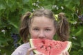 Happy girl eats watermelon in summer. Concept of happy childhood, vacation, vitamins. Selective focus, blur Royalty Free Stock Photo