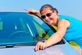 Happy girl embracing his new car Royalty Free Stock Photo