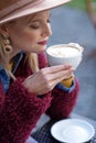 Happy girl enjoying aroma of hot beverage Royalty Free Stock Photo