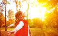 Happy girl enjoying life and freedom in the autumn on nature Royalty Free Stock Photo