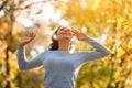 Happy girl enjoying life and freedom in the autumn on the nature Royalty Free Stock Photo