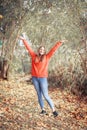 Happy girl enjoying life and freedom in the autumn on nature Royalty Free Stock Photo