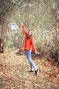 Happy girl enjoying life and freedom in the autumn on nature Royalty Free Stock Photo