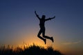 Girl Jumping At Sunset Background. Royalty Free Stock Photo