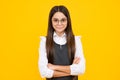 Happy girl face, positive and smiling emotions. Children studio portrait on yellow background. Childhood lifestyle Royalty Free Stock Photo