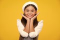 Happy girl face, positive and smiling emotions. Portrait of beautiful happy smiling teenage girl on yellow studio Royalty Free Stock Photo