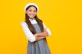Happy girl face, positive and smiling emotions. Portrait of caucasian teen girl with arms folded, isolated on yellow Royalty Free Stock Photo