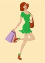 Happy girl in fashion dress and with shopping bags