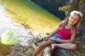 Happy girl fishing at lake Royalty Free Stock Photo