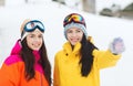 Happy girl friends in ski goggles outdoors Royalty Free Stock Photo