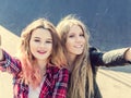 Happy girl friends taking a selfie on a summer day Royalty Free Stock Photo