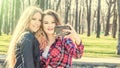 Happy girl friends taking a selfie on a summer day Royalty Free Stock Photo