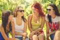 Happy girl friends talking on summer green Royalty Free Stock Photo