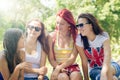 Happy girl friends talking on summer green Royalty Free Stock Photo