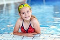 Happy girl with goggles in swimming pool Royalty Free Stock Photo