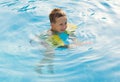 Happy girl with goggles in swimming pool Royalty Free Stock Photo