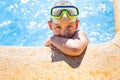 Happy girl with goggles in swimming pool Royalty Free Stock Photo