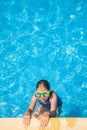 Happy girl with goggles in swimming pool Royalty Free Stock Photo