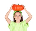 Happy girl in Halloween with a big pumpkin Royalty Free Stock Photo