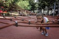 Happy girl having a rest on the playground in local park during her travelling Royalty Free Stock Photo