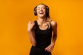 Happy Girl In Headphones Listening To Music Dancing, Studio Shot Royalty Free Stock Photo