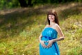 Happy girl heart on the pregnant belly Royalty Free Stock Photo