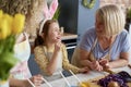 Little girl with her mother and grandmother during Easter Royalty Free Stock Photo