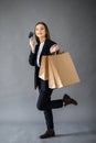 Happy girl hold shopping bag. Shopping with credit card. Smiling girl Royalty Free Stock Photo