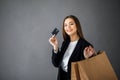 Happy girl hold shopping bag. Shopping with credit card. Smiling girl Royalty Free Stock Photo