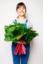 Happy girl holding a bunch of swiss chard Royalty Free Stock Photo